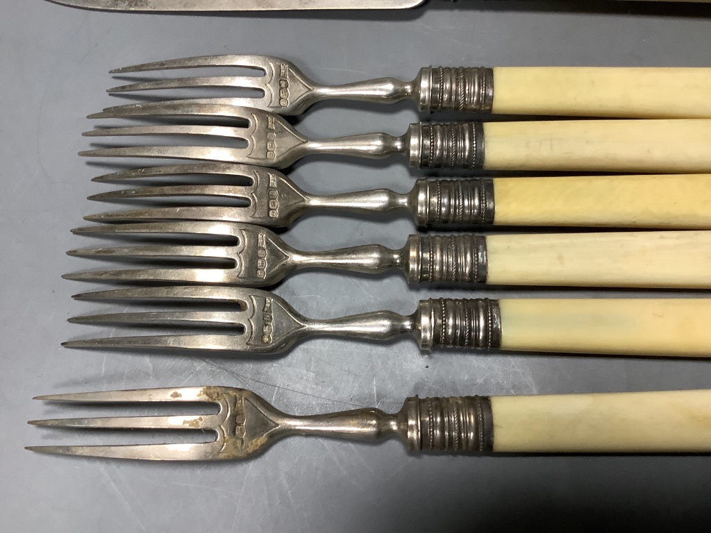 Five pairs of George V ivory handled silver dessert eaters and one other fork, Walker & Hall, Sheffield, 1919.